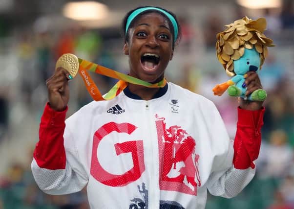 Leeds's Kadeena Cox celebrates with her gold medal won in the Women's C4-5 500m Time Trial final at the Olympic Veleodrome in Rio. Picture: Andrew Matthews/PA