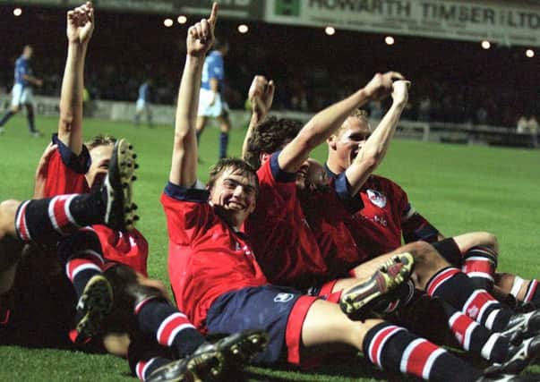 GLORY NIGHTS: York City striker Neil Tolson scored in both legs against Everton and, top and left, leads the celebrations against the Merseysiders. Picture: PA