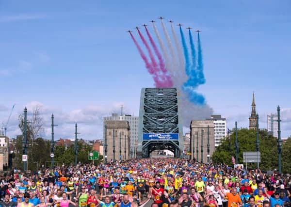 The Red Arrows fly over the Tyne Bridge during the Great North Run in Newcastle. PIC: PA