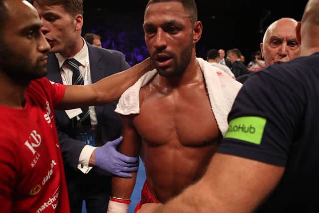 GAME OVER: Kell Brook is walked after his Gennady Golovkin fight ended in the fifth round. Picture: Nick Potts/PA.