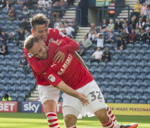 Adam Armstrong celebrates with Adam Hammill after putting Barnsley ahead with his stunning strike.