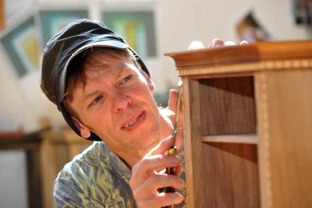 PLUM JOB: Mark working on a small cabinet made from English walnut, plum, apple and holly wood.