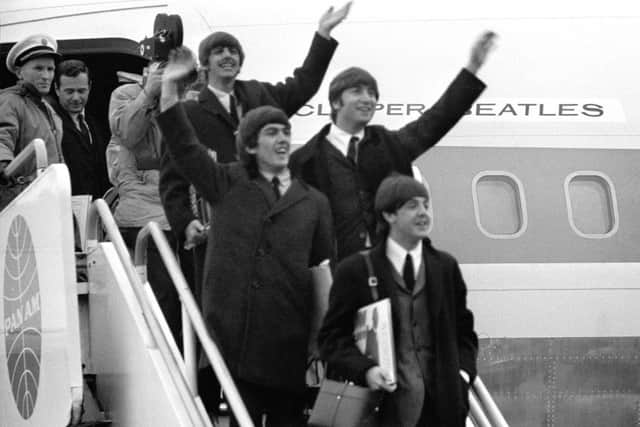 The Beatles arriving at Heathrow Airport after their successful American tour.