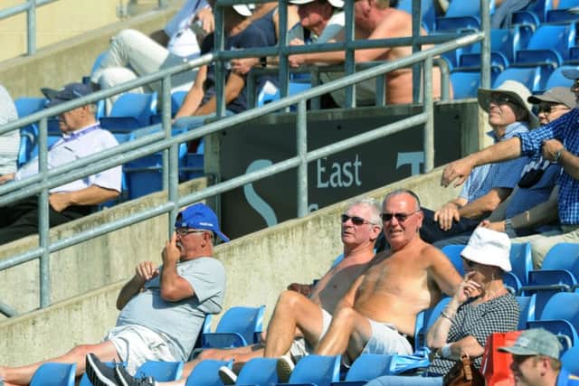 Yorkshire fans cool down on a hot day at Headingley. Picture : Jonathan Gawthorpe