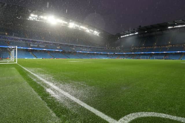 Heavy rain before the Champions League match at the Etihad Stadium, Manchester.