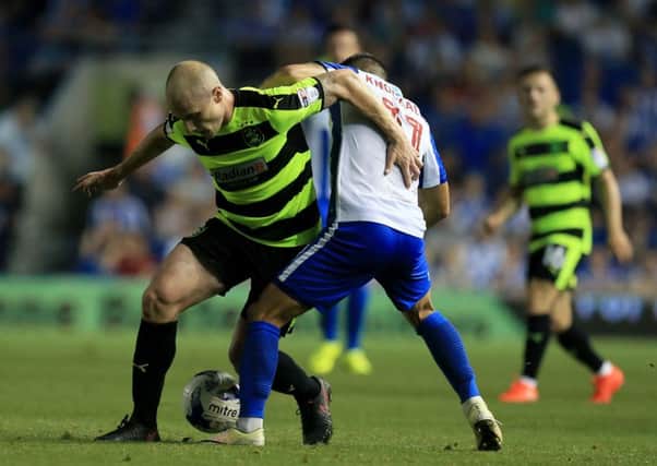 Huddersfield Town's Aaron Mooy (left) is challenged by Brighton & Hove Albion's Anthony Knockaert Picture: Gareth Fuller/PA