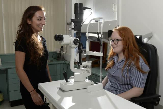 13 year old Becky Crossthwaite at Hunslet Carr Vision Centre  with optomotrist Kiran Lally.