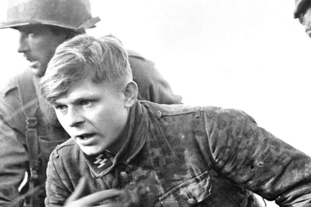 A young German SS soldier captured during the battle in Ardennes during the Second World War.