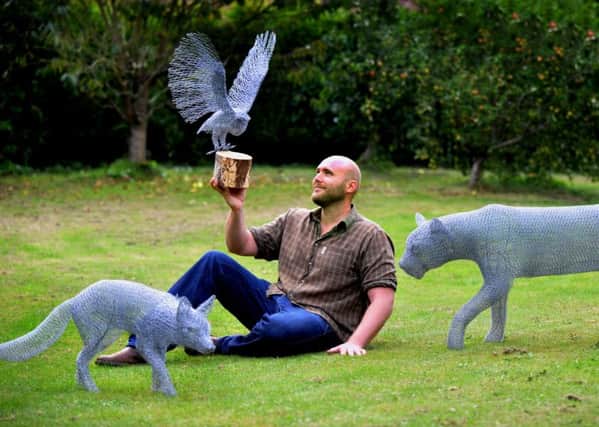 Richard Gibson, of Shiptonthorpe, with his wire creations of a fox, barn owl and leopard. Picture: Gary longbottom