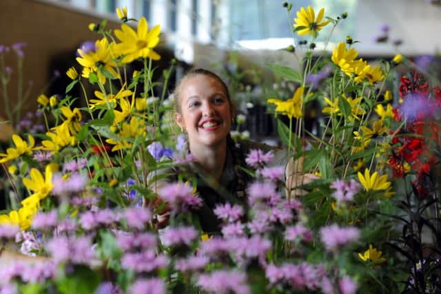 Megan Suley pictured amongst the flowers. Picture: Simon Hulme