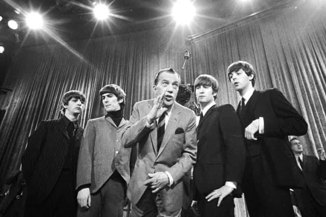 The Beatles during a rehearsal for the British group's first American appearance, on the "Ed Sullivan Show," in New York on February 9, 1964. From left:  Ringo Starr, George Harrison, Sullivan, John Lennon and Paul McCartney.