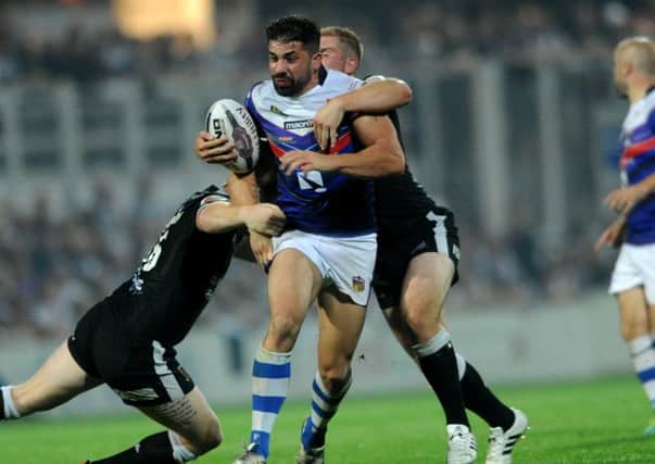 Wakefield Trinity Wildcats' Mika Simon is tackled by Hull's Jordan Thompson and Danny Washbrook (Picture : Jonathan Gawthorpe).