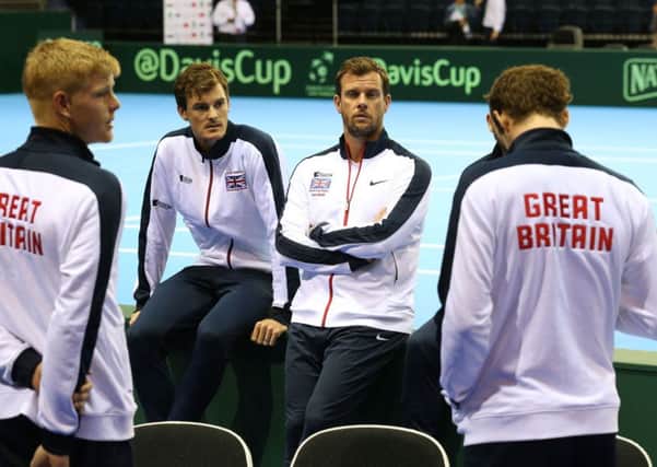Great Britain's Jamie Murray (centre left) and Leon Smith (centre right) speak with Andy Murray (right) and Kyle Edmund (left) during the training session at the Emirates Arena, Glasgow.