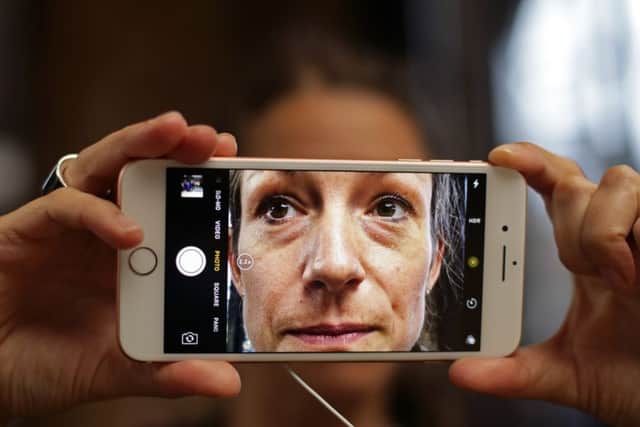 Fans get their hands on the new iPhone 7 at the Apple store in Covent Garden, London.
