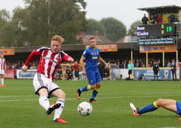 Sheffield United's Mark Duffy scoring his side's opening goal against Wimbledon. Picture:  David Klein/Sportimage
