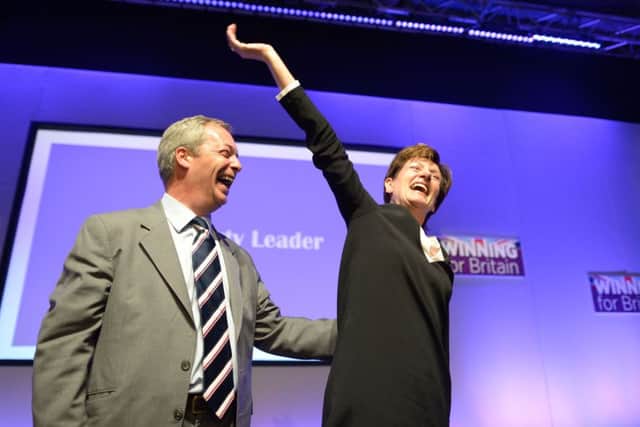 Diane James celebrates with Nigel Farage after being named as the new leader of Ukip