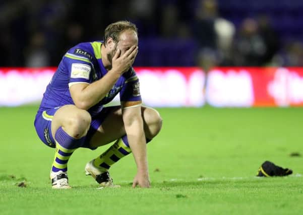 Warrington Wolves' Chris Hill shows his dejection after the game against Wigan Warriors.