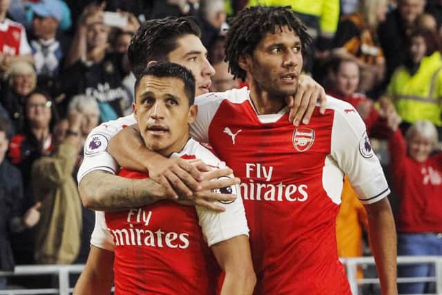 Arsenal's Alexis Sanchez celebrates scoring his side's third (Photo: PA)