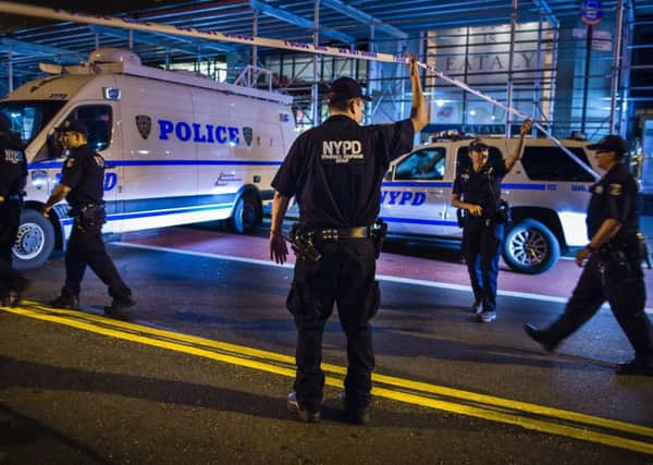 Police arrive on the scene of an explosion in Manhattan's Chelsea neighborhood