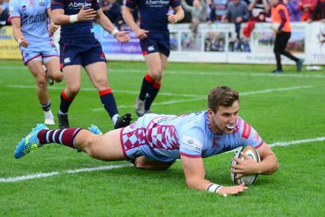 OVER YOU GO: Rotherham Titans' Cameron Hudson scores a try against London Scottish. Picture Scott Merrylees
