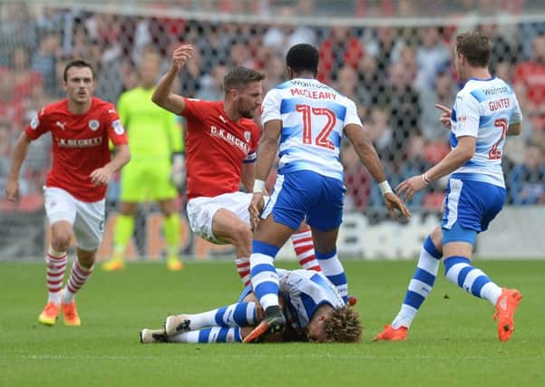 Reading's Garath McCleary fouls Barnsley's Conor Hourihane, which saw him shown a a red card (Picture: Anna Gowthorpe/PA Wire).