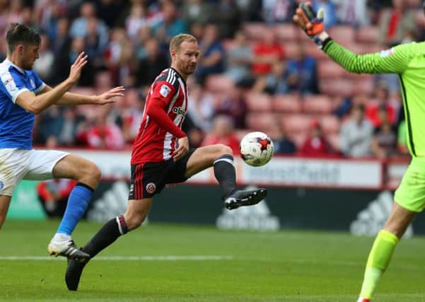 Sheffield United's match-winner Matt Done attempts to lob Peterborough goalkeeper Luke McGee (Picture: Simon Bellis/Sportimage).