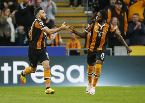 Robert Snodgrass, left, is congratulated after scoring from the penalty spot for Hull City but Arsenal won the match 4-1 (Picture: Danny Lawson/PA Wire).