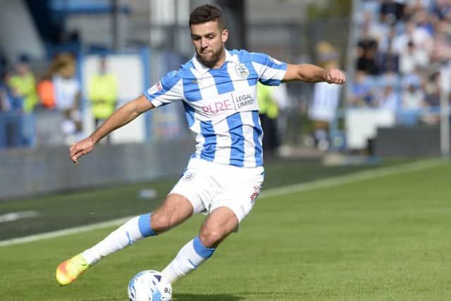 Huddersfield Town's Tommy Smith puts in a cross from the right against QPR on Saturday.
 Picture: Bruce Rollinson