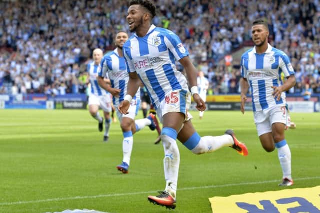 LEADING THE WAY: Kasey Palmer celebrates his opening goal for Huddersfield Town.  Picture Bruce Rollinson