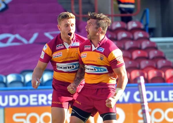 Giants' Danny Brough celebrates scoring his try with Kyle Wood. Picture Tony Johnson.
