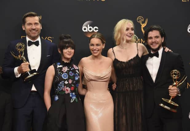 Nikolaj Coster-Waldau, from left, Maisie Williams, Emilia Clarke, Sophie Turner, and Kit Harington winners of the award for outstanding drama series for Game of Thrones