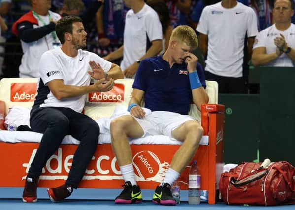 Great Britain's Kyle Edmund is consolidated by captain Leon Smith during day one of the Davis Cup semi-final against Argentina. Picture: Andrew Milligan/PA.