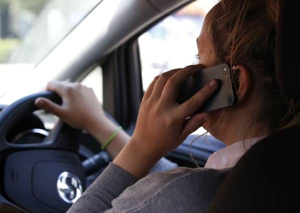 Motorists caught using their mobile phone while at the wheel face bigger fines, but do they go far enough?
