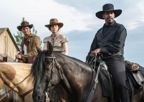 Sharpshooter: Scene from the remake of The Magnificent Seven, withLuke Grimes, Haley Bennett and Denzel Washington.
