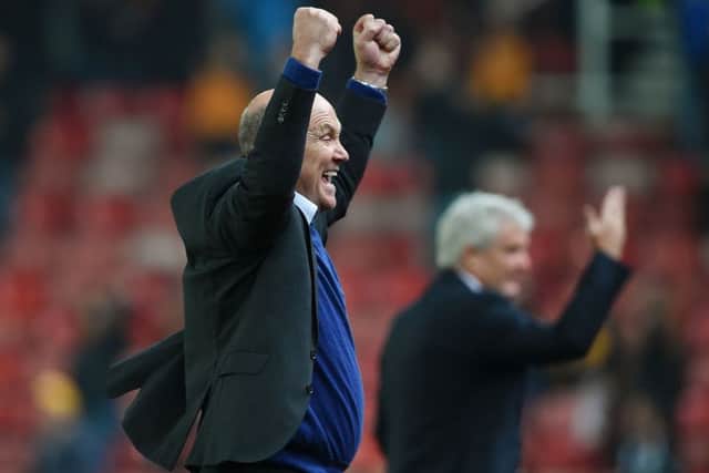 Hull City caretaker manager Mike Phelan celebrates.