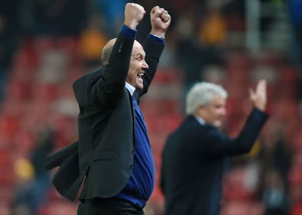 Hull City caretaker manager Mike Phelan celebrates.