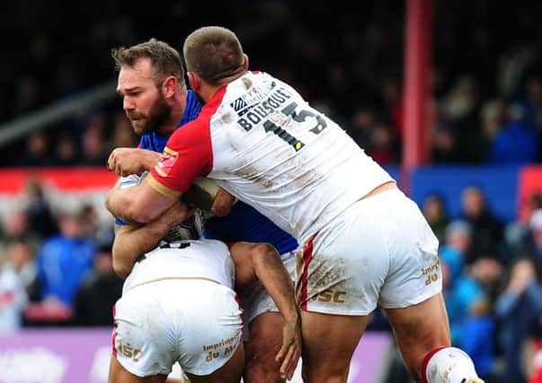 Wakefield's Scott Anderson is held by Catalan's defence.
 (Picture: Jonathan Gawthorpe)