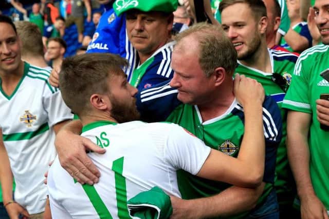 Stuart Dallas speak to his dad after Northern Ireland's defeat to Wales. in Euro 2016.