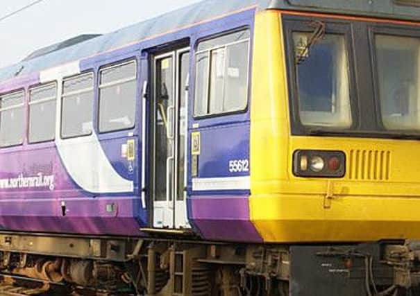 A Northern Rail service had to stop after a family were spotted on the railway tracks.