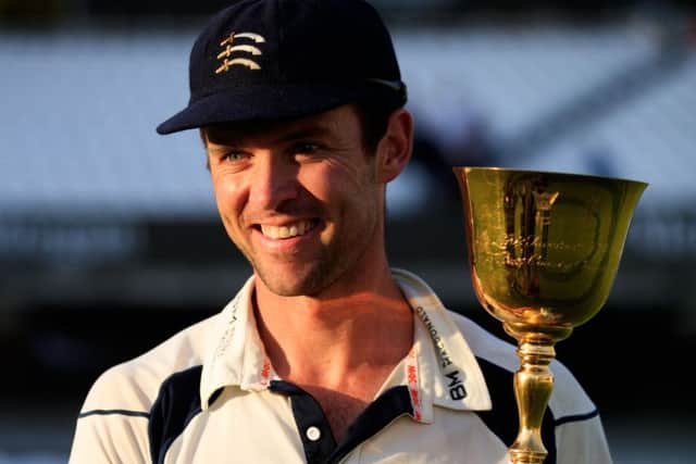 Middlesex captain James Franklin with the County Championship trophy after a stunning win over Yorkshire. Picture: John Walton/PA.