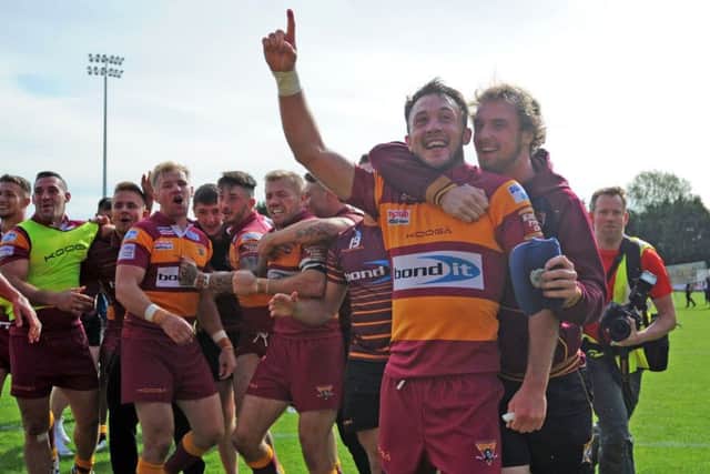 Huddersfield Giants celebrate staying up in Super League.