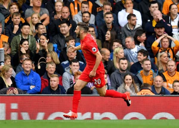 Liverpool's Adam Lallana celebrates scoring his side's first goal of the game during the Premier League match at Anfield, Liverpool. (Picture: PA)