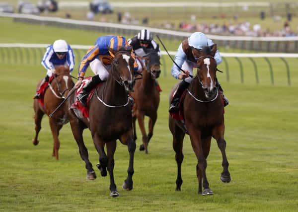 Brave Anna ridden by Seamie Heffernan (right) gets the better of Roly Poly ridden by Ryan Moore to win The Connolly's Red Mills Cheveley Park Stakes at Newmarket. Picture: Julian Herbert/PA
