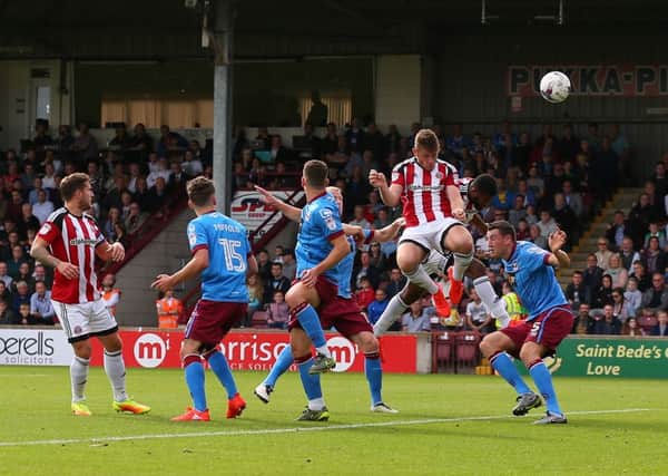 Jack O'Connell of Sheffield United rises up to direct a header goalwards at Scunthorpe. (Picture: Simon Bellis/Sportimage)