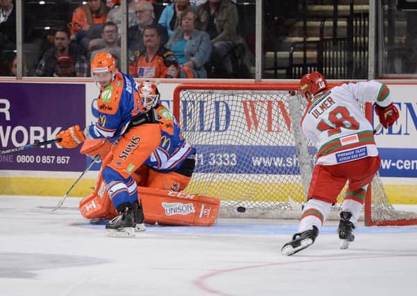 BAD NIGHT: Layne Ulmer levels for Cardiff Devils just after the halfway mark at Sheffield Arena. Picture: Dean Woolley.