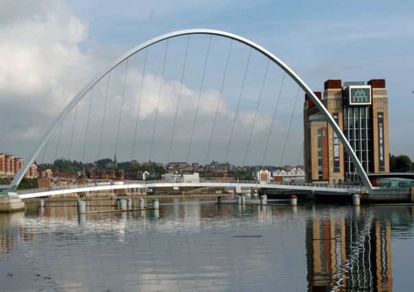 The River Tyne in Newcastle showing the Millennium footbridge and the Baltic Mills gallery in Gateshead.