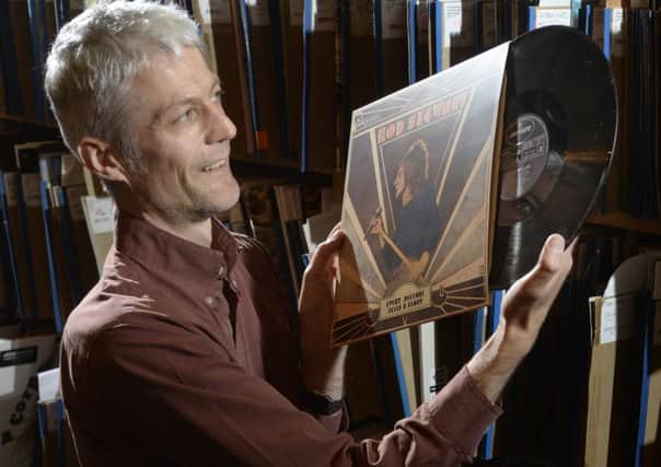 Manager at Jumbo Records, Adam Gillison, with Rod Stewart's 'Every Picture tells a Story'. Picture: Bruce Rollinson