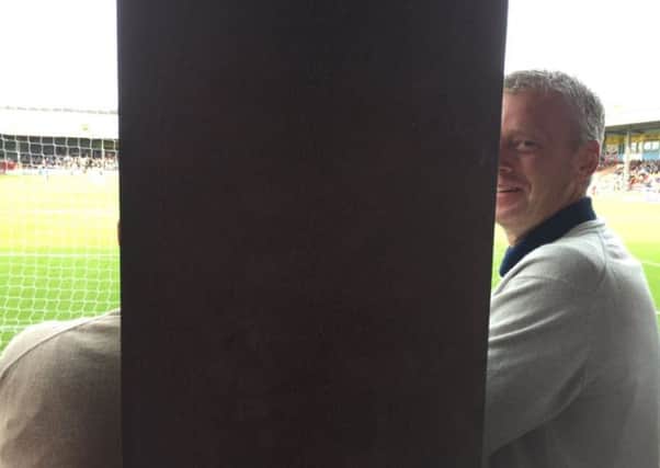 Blades fan Daniel Munro had his view blocked  by a pillar at Scunthorpe United's Glanford Park. Picture: Ross Parry Agnecy