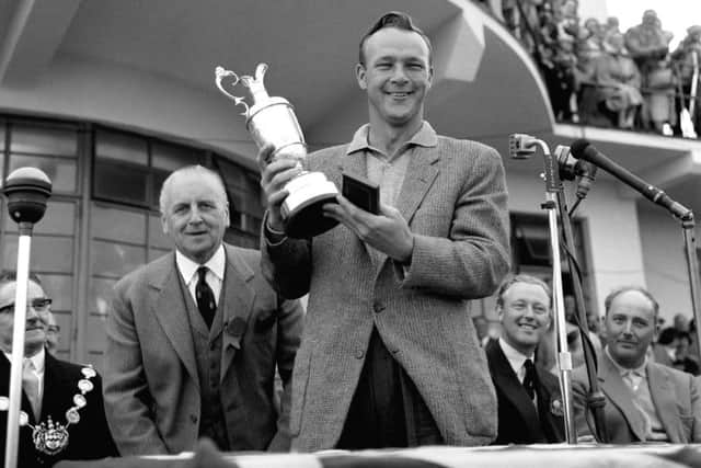 Palmer lifts the Claret Jug after winning the 1961 British Open. PA/PA Wire.