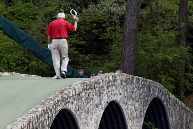 Palmer walks across the Hogan Bridge during his final Masters appearance as a competitor in 2004. He was a four-time winner of the Major. (AP Photo/Amy Sancetta)
